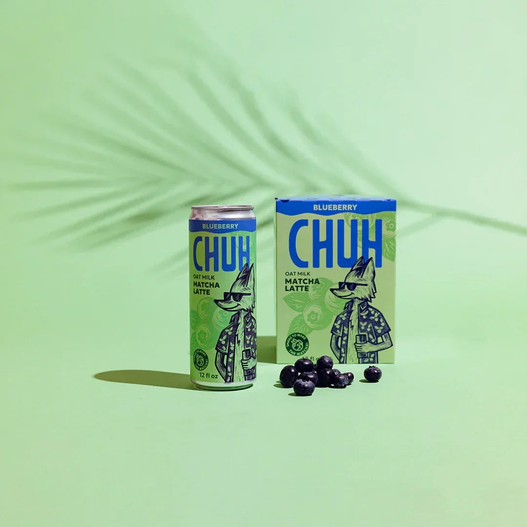 CHUH blueberry oat milk matcha latte can and box on a green background