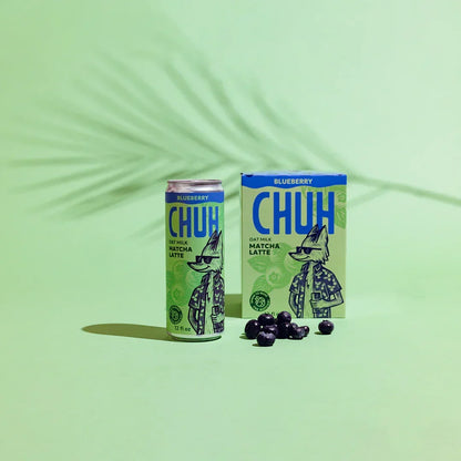 CHUH blueberry oat milk matcha latte can and box on a green background
